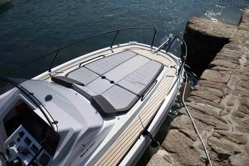 Slide: The Image of 2024 Beneteau Flyer 8 SUNdeck moored at a stone dock. - 12