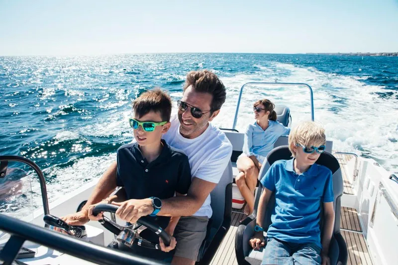 Slide: The Image of Family enjoying a ride on a 2024 Beneteau Flyer 8 SUNdeck boat. - 15