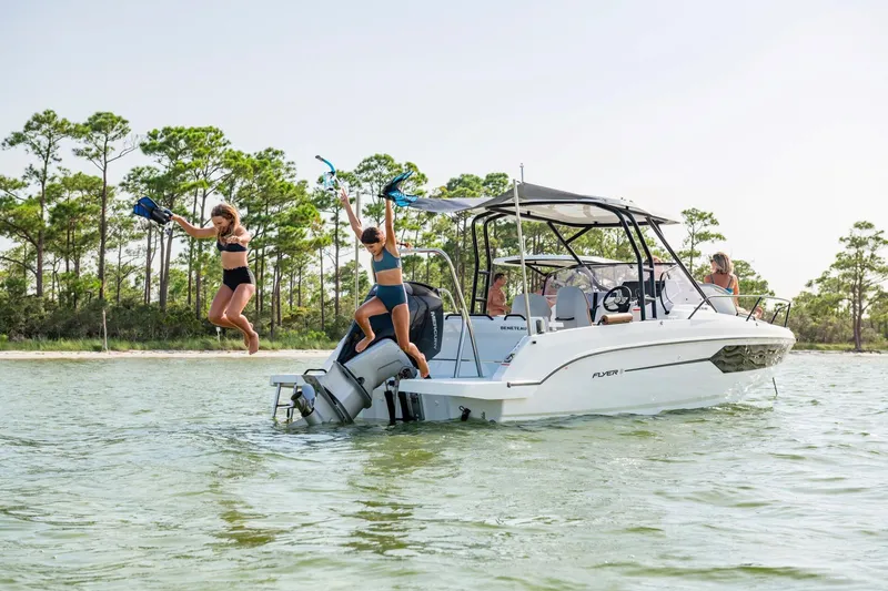 Slide: The Image of Beneteau Flyer 8 SUNdeck 2026 with people jumping into water. - 5