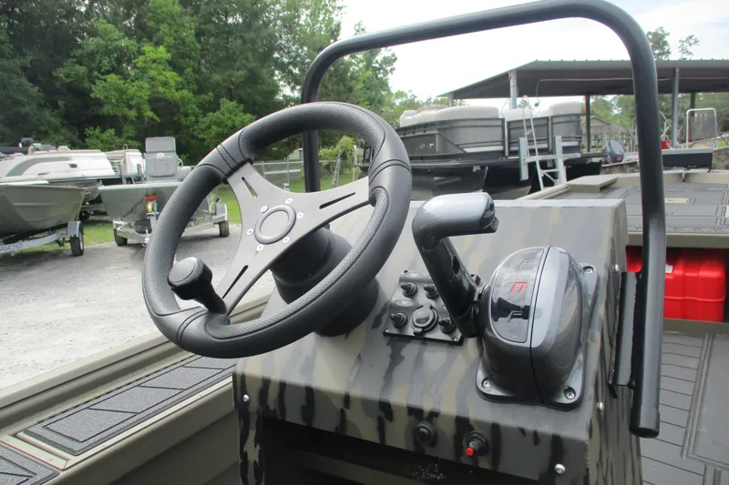 Slide: The Image of Steering console of 2026 Gator Tail 2060 Extreme CC boat, featuring modern controls. - 10