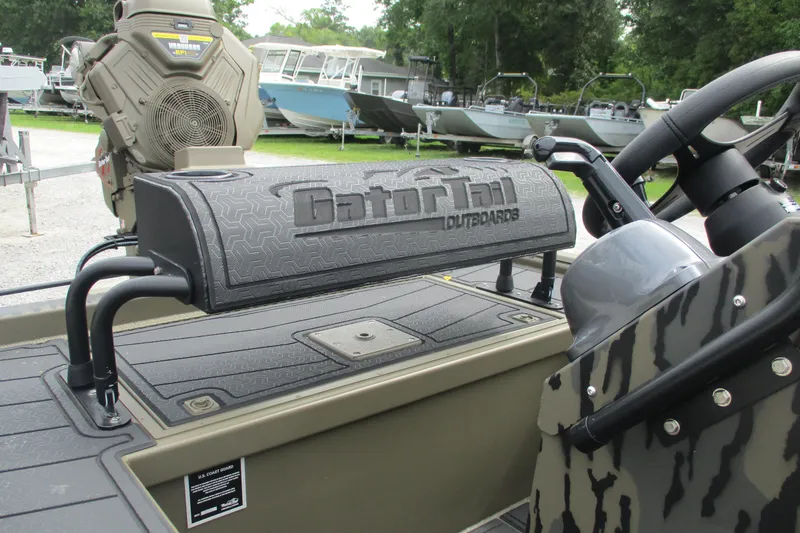 Slide: The Image of 2026 Gator Tail 2060 Extreme CC boat with camo design and outboard motor. - 12