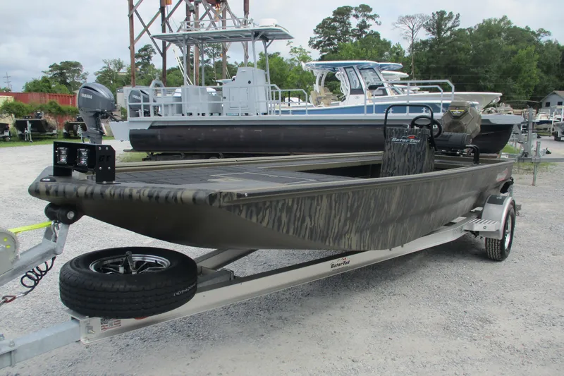 Slide: The Image of 2026 Gator Tail 2060 Extreme CC boat on trailer, parked outdoors. - 3