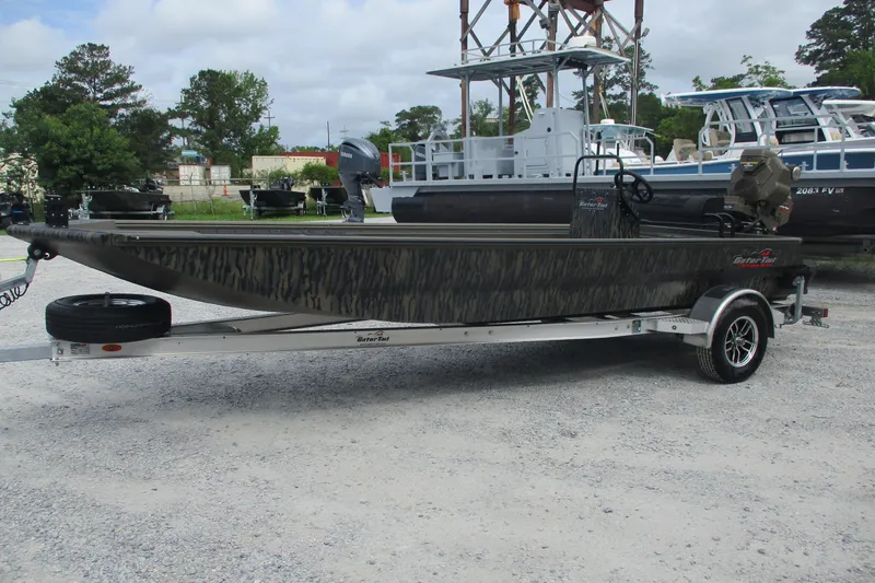 Slide: The Image of 2026 Gator Tail 2060 Extreme CC boat on trailer, parked outdoors. - 4