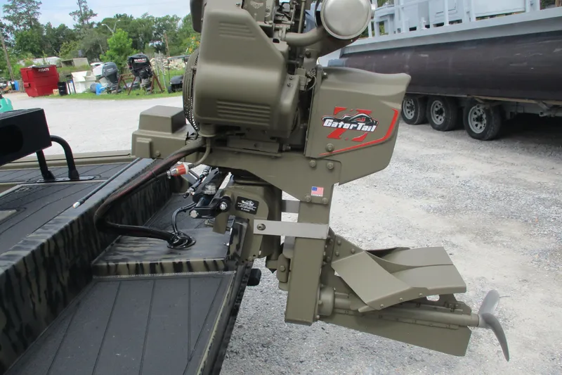 Slide: The Image of 2026 Gator Tail 2060 Extreme CC boat motor, parked outdoors on gravel. - 6