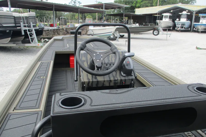 Slide: The Image of 2026 Gator Tail 2060 Extreme CC boat interior with steering wheel and console. - 9