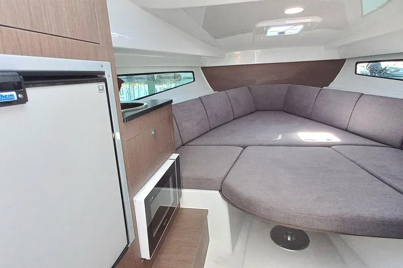 Slide: The Image of Interior of 2026 Beneteau Flyer 8 SUNdeck with cozy seating area. - 10