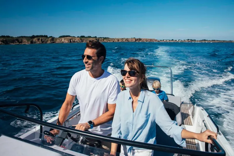 Slide: The Image of Couple enjoying a ride on a 2024 Beneteau Flyer 8 SUNdeck boat. - 16