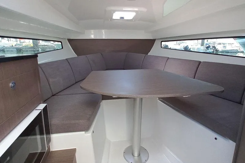 Slide: The Image of Interior of 2026 Beneteau Flyer 8 SUNdeck with cozy seating area. - 9