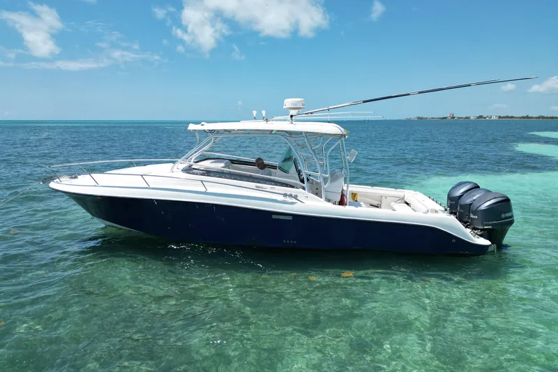 The Image of 2005 Hydra-Sports Vector 3300 VX boat on clear turquoise water under blue sky. - 1
