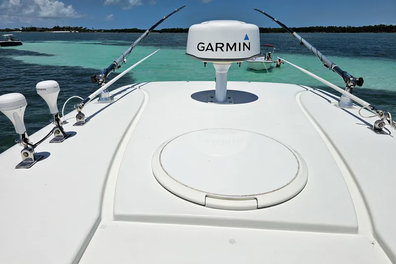Slide: The Image of 2005 Hydra-Sports Vector 3300 VX boat with Garmin equipment on turquoise water. - 13