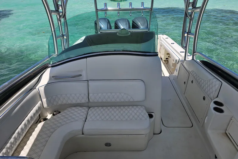 Slide: The Image of 2005 Hydra-Sports Vector 3300 VX boat interior with white seating and clear ocean backdrop. - 14