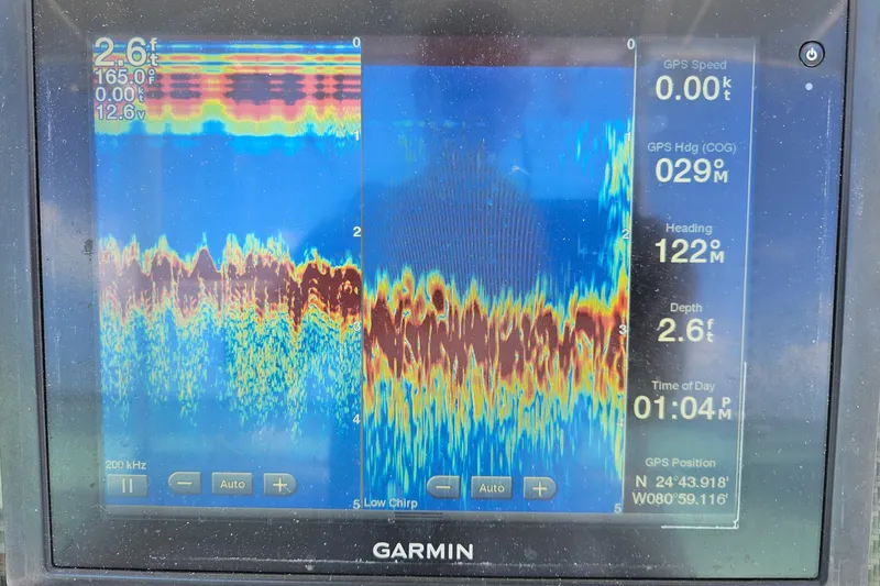 Slide: The Image of Garmin sonar display on 2005 Hydra-Sports Vector 3300 VX, showing depth and GPS data. - 18