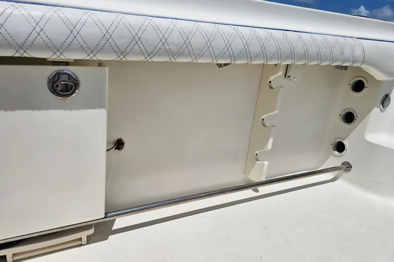 Slide: The Image of 2005 Hydra-Sports Vector 3300 VX boat interior detail with storage and rod holders. - 19