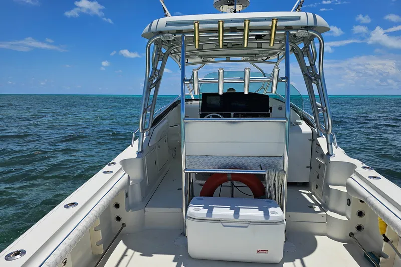 Slide: The Image of 2005 Hydra-Sports Vector 3300 VX boat on open water under clear blue sky. - 22