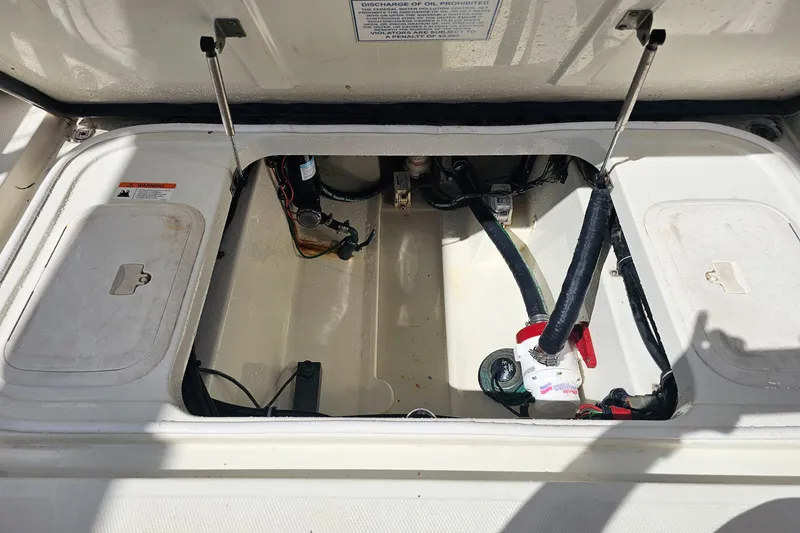 Slide: The Image of Open engine compartment of a 2005 Hydra-Sports Vector 3300 VX boat. - 24