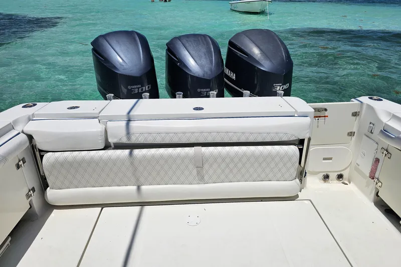 Slide: The Image of 2005 Hydra-Sports Vector 3300 VX boat with triple Yamaha 300 engines on turquoise water. - 26