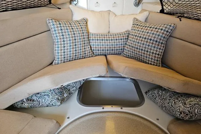 Slide: The Image of 2005 Hydra-Sports Vector 3300 VX cabin interior with cushioned seating and patterned pillows. - 28