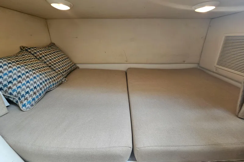 Slide: The Image of Interior cabin of 2005 Hydra-Sports Vector 3300 VX with cozy bedding and cushions. - 30