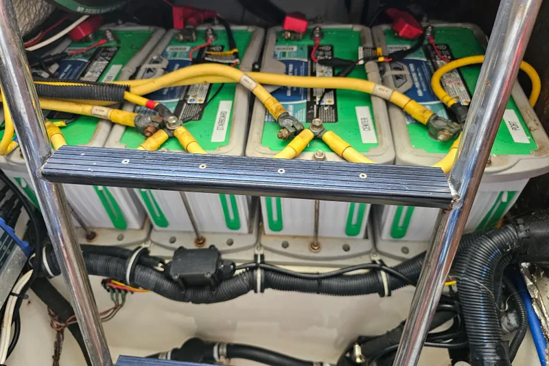Slide: The Image of Battery compartment of a 2005 Hydra-Sports Vector 3300 VX with connected cables. - 32