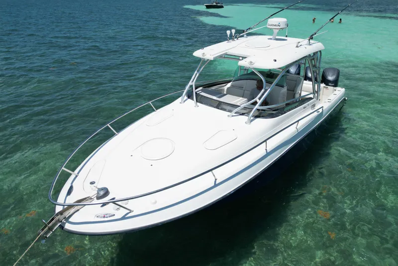 Slide: The Image of 2005 Hydra-Sports Vector 3300 VX boat on clear turquoise water. - 4