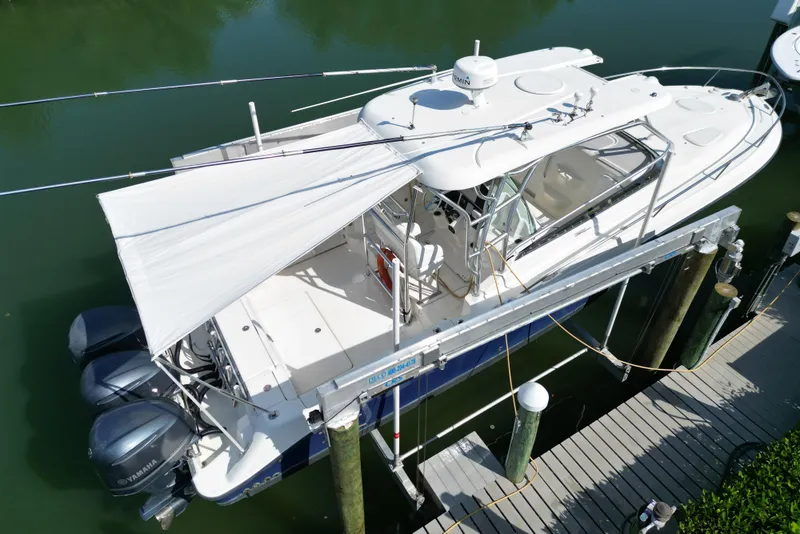 Slide: The Image of 2005 Hydra-Sports Vector 3300 VX boat docked with canopy, viewed from above. - 6