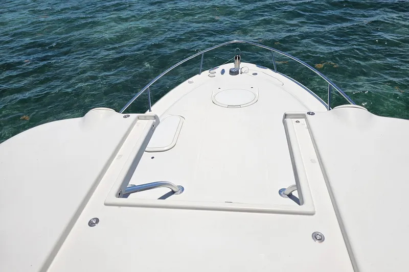 Slide: The Image of 2005 Hydra-Sports Vector 3300 VX boat deck overlooking clear ocean water. - 9