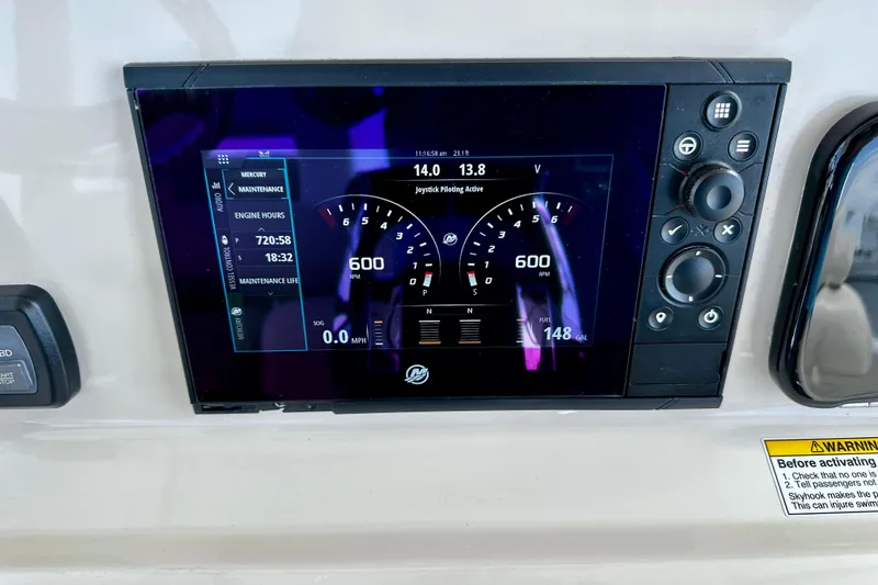 Slide: The Image of Dashboard display of a 2019 Boston Whaler 330 Outrage boat showing engine metrics. - 11