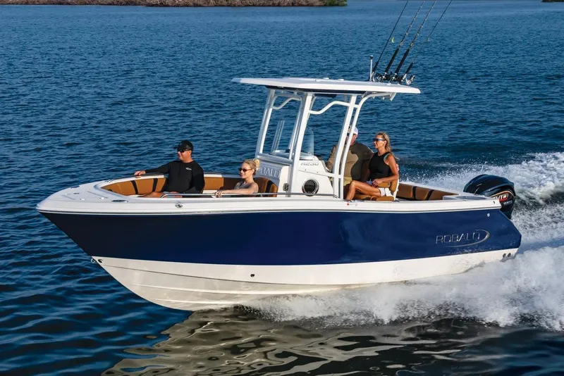 The Image of Manufacturer Provided Image: 2025 Robalo R230 Center Console boat cruising on open water with passengers. - 0