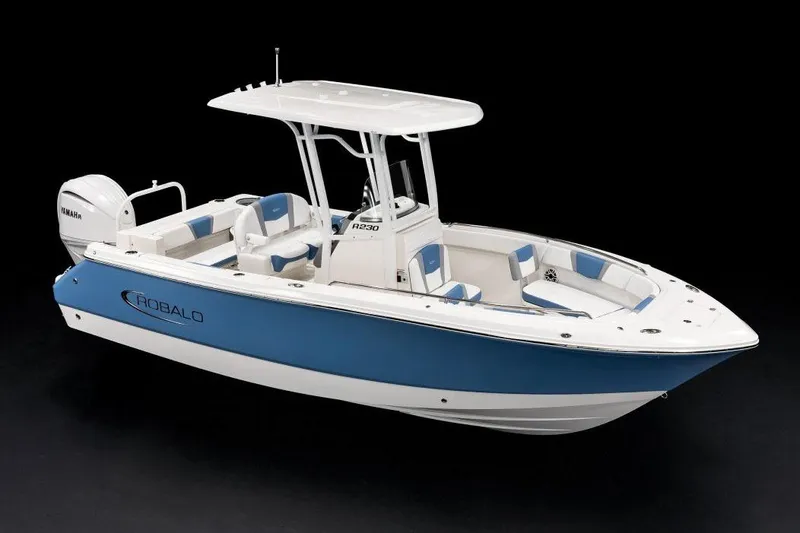 Slide: The Image of Manufacturer Provided Image: 2026 Robalo R230 Center Console boat with blue and white design, featuring Yamaha engine. - 5