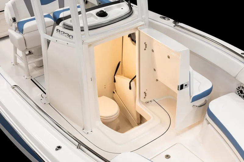 Slide: The Image of Manufacturer Provided Image: 2026 Robalo R230 Center Console boat interior with open compartment and seating. - 7