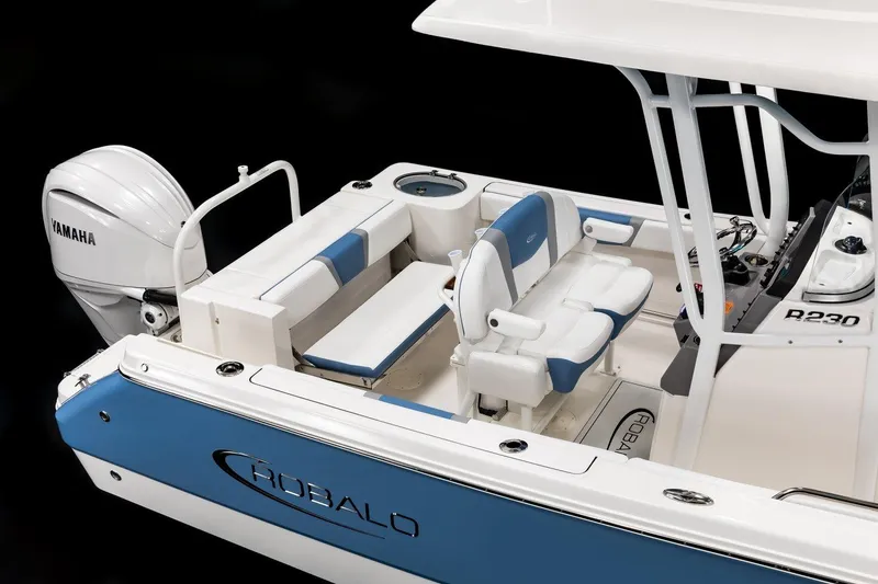 Slide: The Image of Manufacturer Provided Image: 2026 Robalo R230 Center Console boat with Yamaha engine, featuring blue and white seating. - 9