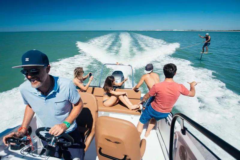 Slide: The Image of People enjoying a ride on a 2024 Beneteau Flyer 8 SPACEdeck boat. - 22
