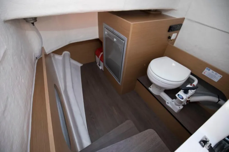 Slide: The Image of Interior of 2024 Beneteau Flyer 8 SPACEdeck boat with toilet and storage. - 26
