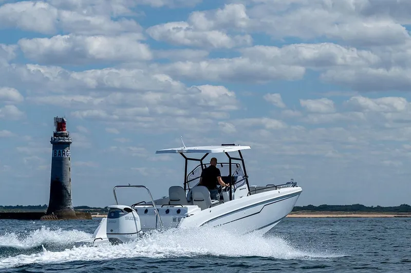 Slide: The Image of Beneteau Flyer 8 SPACEdeck 2026 cruising near a lighthouse. - 4