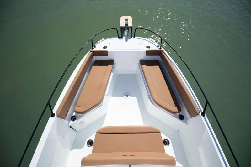 Slide: The Image of 2024 Beneteau Flyer 8 SPACEdeck boat with cushioned seating on calm water. - 7