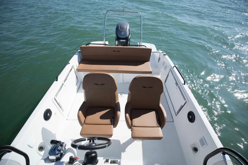 Slide: The Image of 2024 Beneteau Flyer 8 SPACEdeck boat interior with brown seats on water. - 9