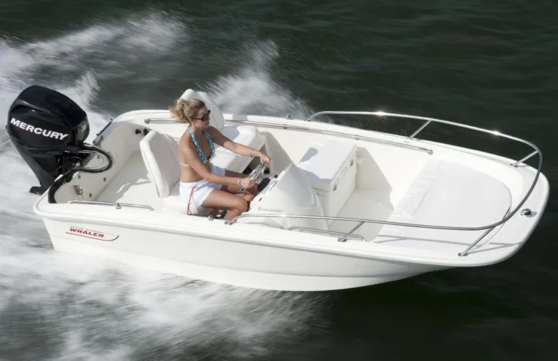Slide: The Image of Manufacturer Provided Image: 2016 Boston Whaler 130 Super Sport boat cruising on water. - 4