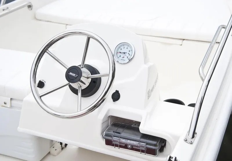 Slide: The Image of Manufacturer Provided Image: 2016 Boston Whaler 130 Super Sport steering console and dashboard. - 8