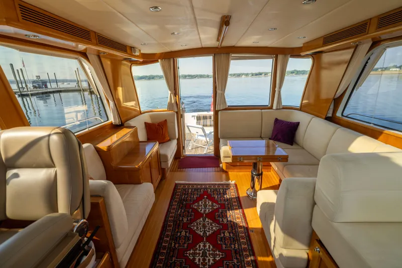 Slide: The Image of Luxurious interior of 2008 Grand Banks 45 Eastbay SX yacht with elegant seating and scenic views. - 13