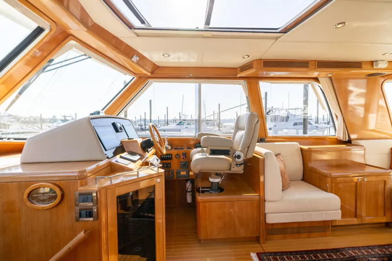 Slide: The Image of Luxurious interior of 2008 Grand Banks 45 Eastbay SX yacht with elegant seating and scenic views. - 15