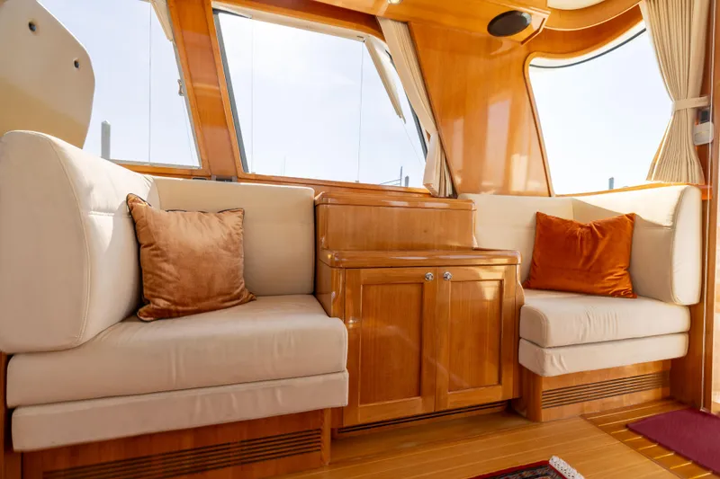 Slide: The Image of Luxurious interior of 2008 Grand Banks 45 Eastbay SX yacht with plush seating and wood finish. - 19