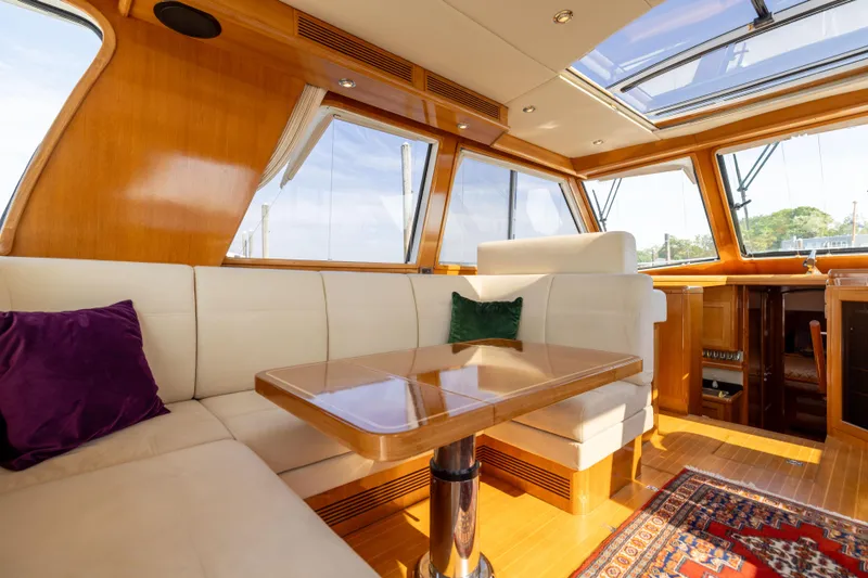 Slide: The Image of Luxurious 2008 Grand Banks 45 Eastbay SX yacht interior with plush seating and elegant wood finishes. - 20