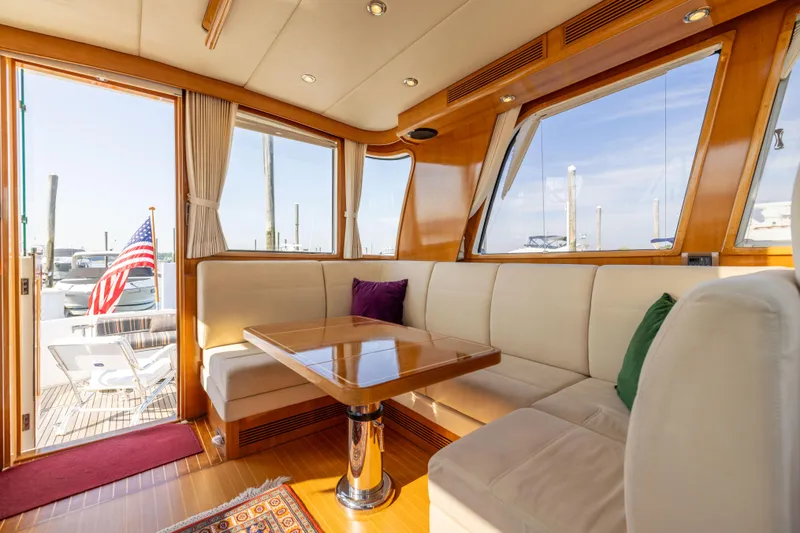 Slide: The Image of Luxurious interior of 2008 Grand Banks 45 Eastbay SX yacht with elegant seating and wooden accents. - 22