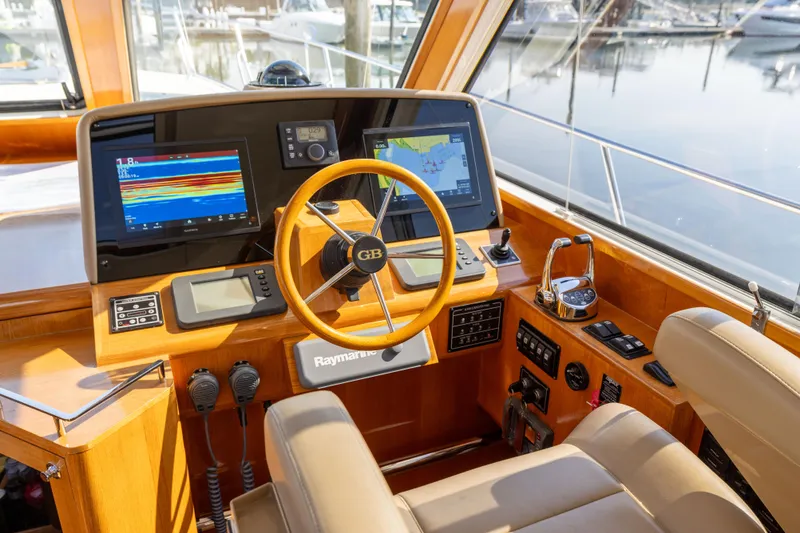 Slide: The Image of Helm of 2008 Grand Banks 45 Eastbay SX with navigation screens and controls. - 26