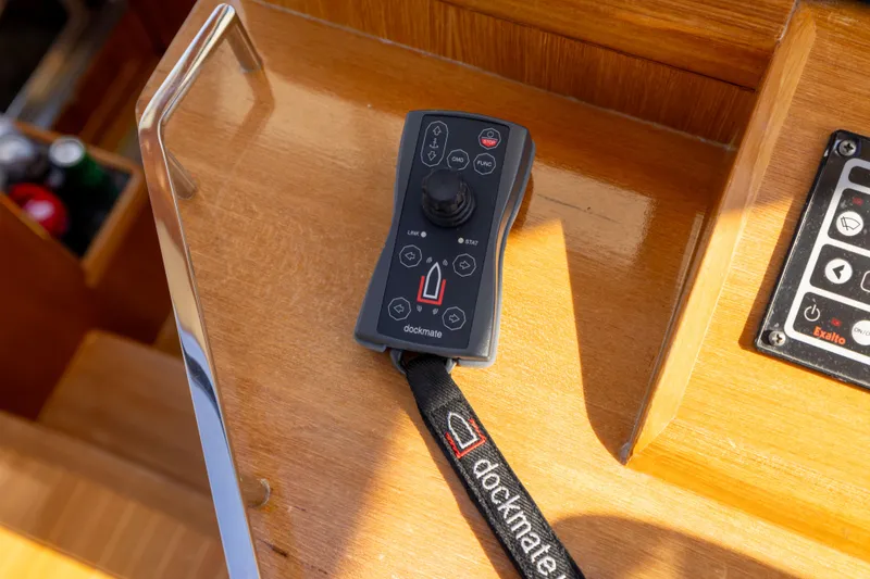 Slide: The Image of Remote control on 2008 Grand Banks 45 Eastbay SX yacht, wooden surface background. - 28