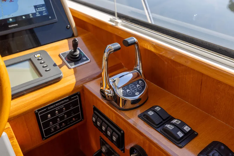Slide: The Image of Control panel of 2008 Grand Banks 45 Eastbay SX yacht with navigation and throttle controls. - 32