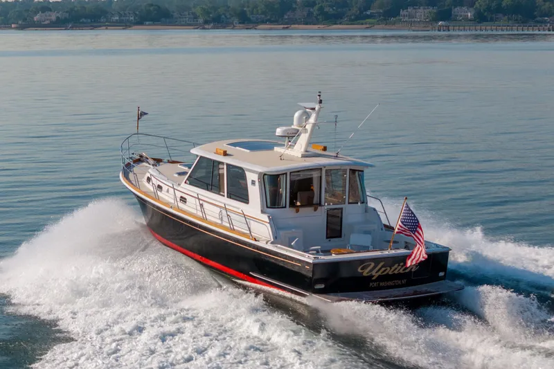 Slide: The Image of Luxurious 2008 Grand Banks 45 Eastbay SX yacht interior with elegant wood cabinetry and modern kitchen amenities. - 36