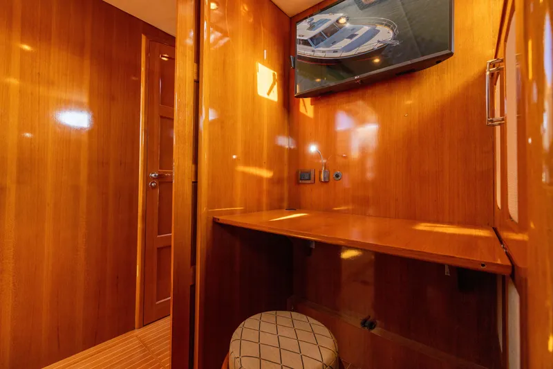 Slide: The Image of Luxurious wooden interior of 2008 Grand Banks 45 Eastbay SX yacht with TV and desk. - 43