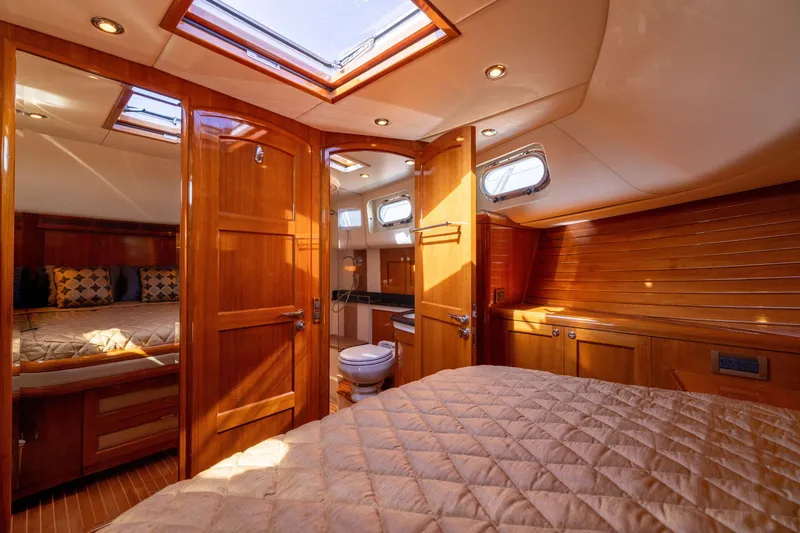 Slide: The Image of Luxurious interior of 2008 Grand Banks 45 Eastbay SX yacht with wood finish and skylight. - 49