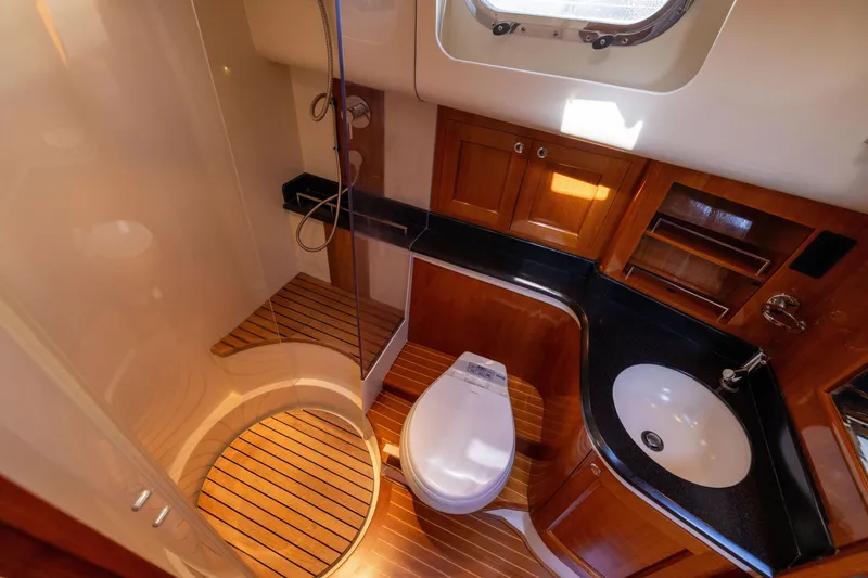 Slide: The Image of Luxurious 2008 Grand Banks 45 Eastbay SX yacht bathroom with wood accents and modern fixtures. - 52